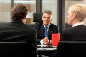 two people talking to staff