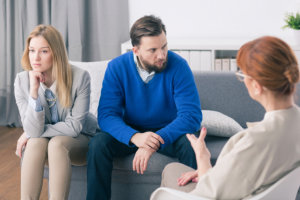 professional and couple in a meeting