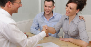 businessman and couple agreeing on business